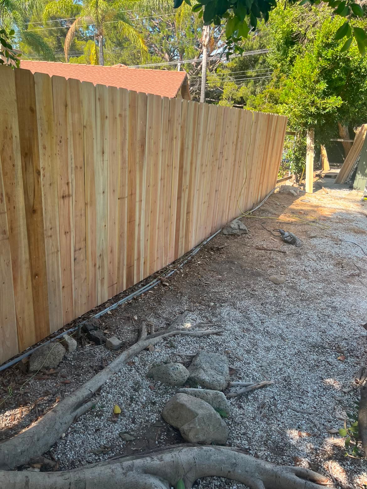 Completed wood fence installed by Campos Lawn Care